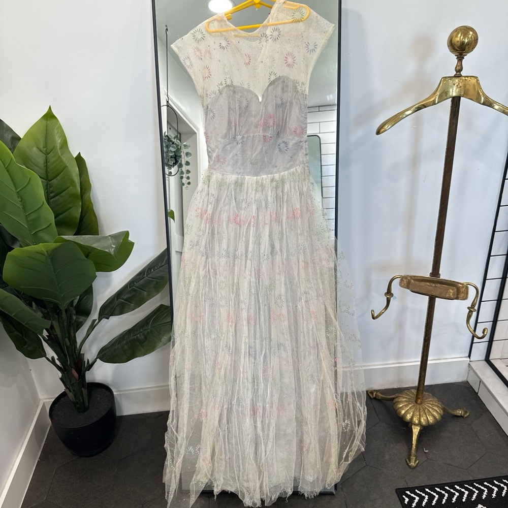 Elegant Sheer Gown with Floral Accents